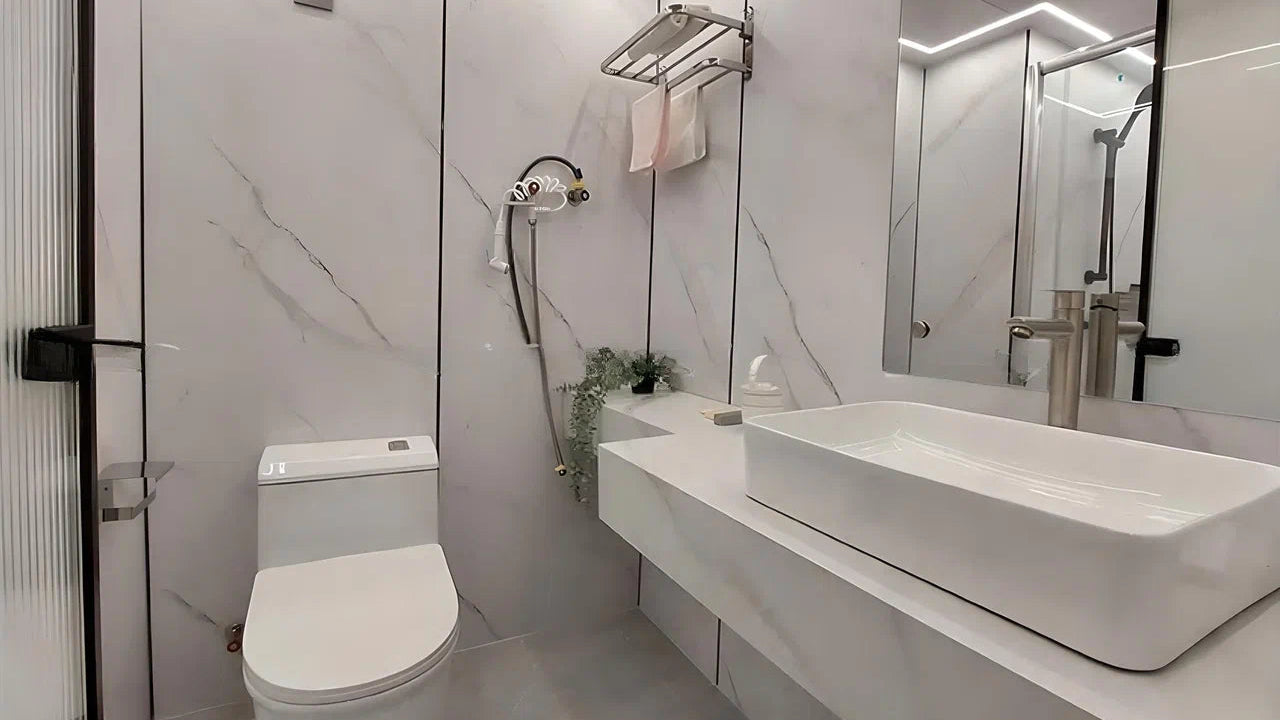Modern bathroom with white toilet, sink, and shower area in AP-2 Balanced Apple Cabin