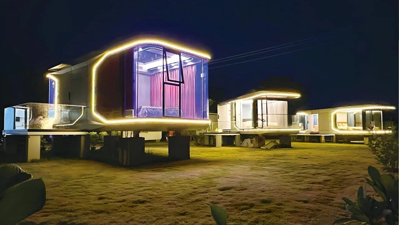 Modern modular hospitality pods (SX-1 Lite space capsule) with glowing edges at night.