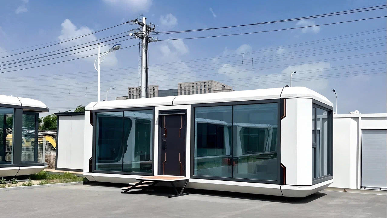 Modern modular Apple Cabin AP-2 Balanced on a clear day with power lines in the background
