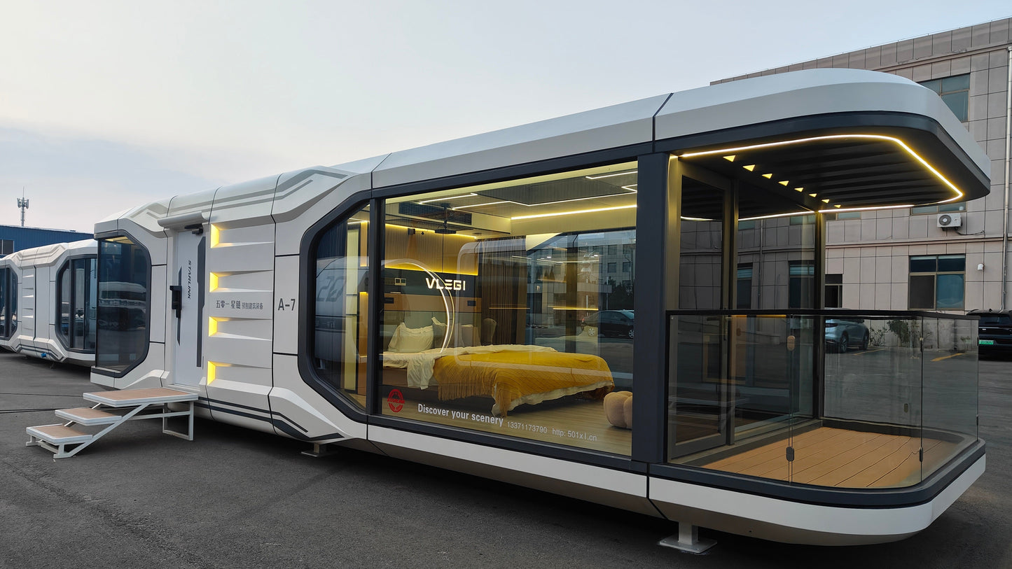 Modern modular SX-3 Vista space capsule pod with glass walls on a concrete surface