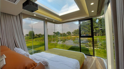 Luxury modular capsule SX-2 flow space pos bedroom with panoramic glass walls and nature view, designed for Airbnb, glamping sites and modern outdoor accommodations