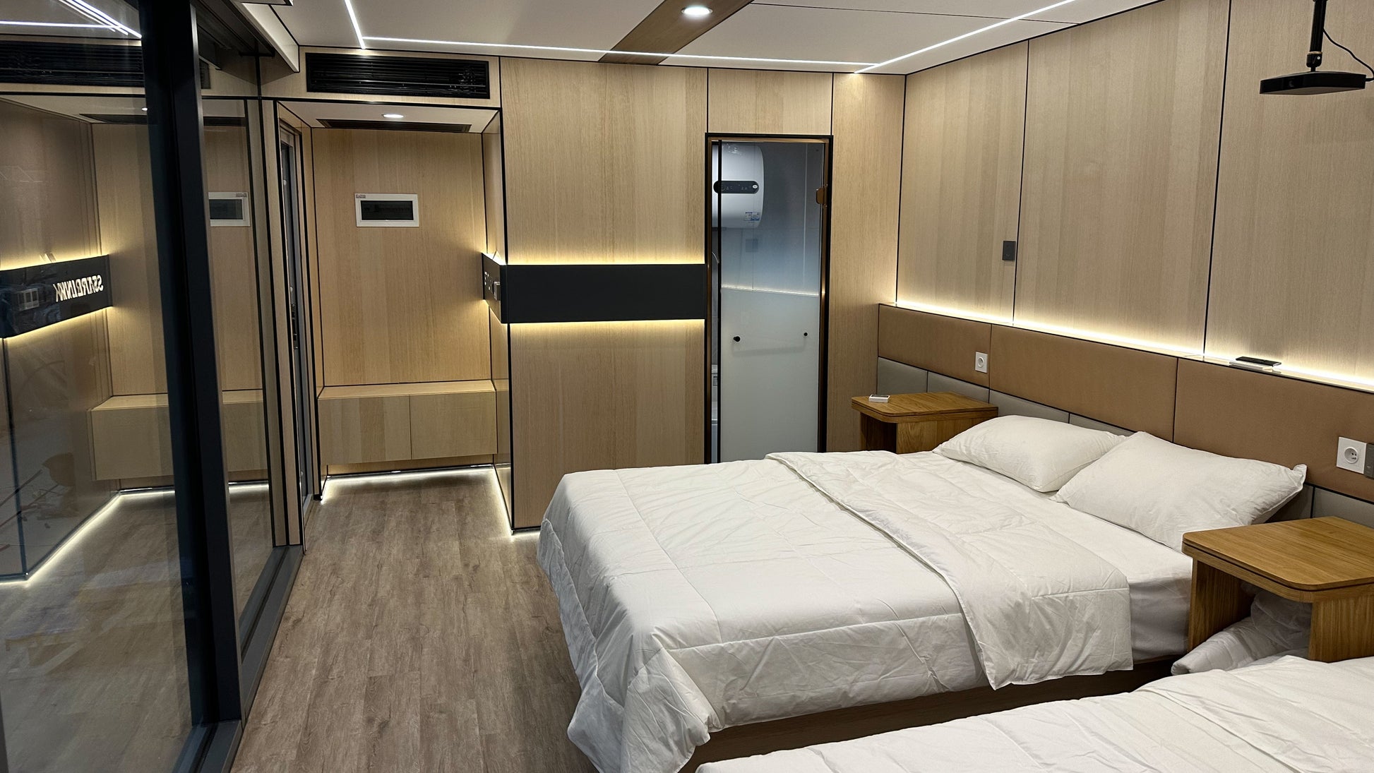 Modern bedroom with wooden cabinets and a bed in AP-2 Balanced Apple Cabin